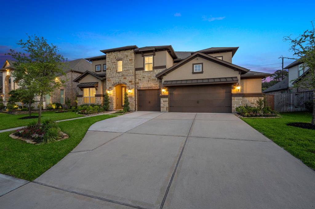 Welcome Home to Longwood Reach.This striking stucco and stone two-story home effortlessly blends timeless elegance with modern design.
