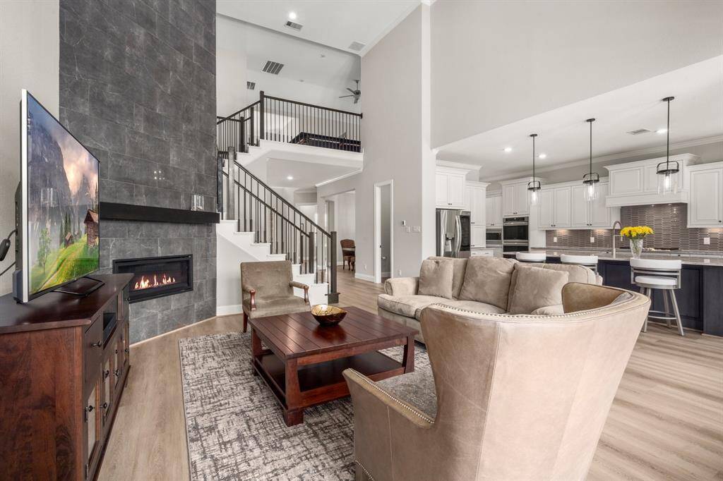 The open-concept layout allows for effortless flow between the kitchen, breakfast area, and living space.