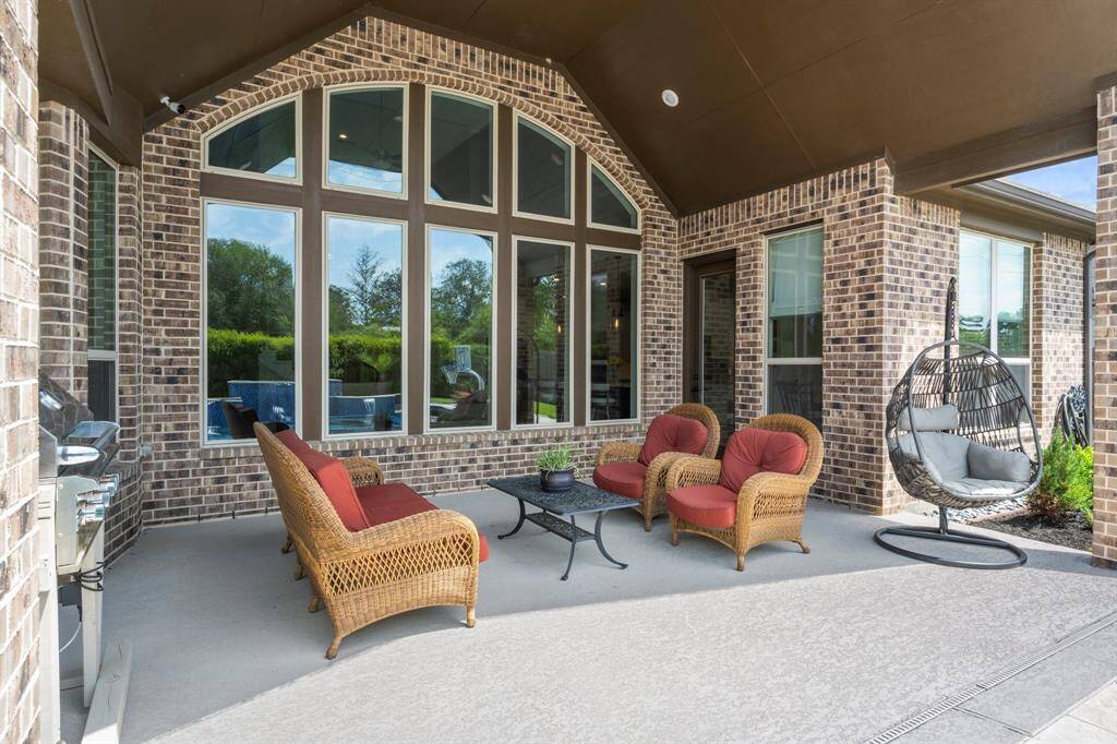 The extended covered patio includes recessed lighting and a gas hookup for your grill—ideal for year-round entertaining.