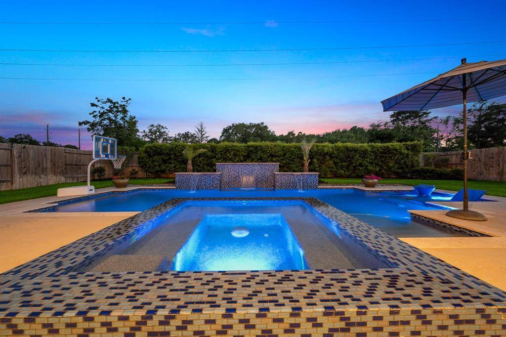 A large oversized spa with tile surround, enjoy cool nights and hot summers while watching the family play in the pool.