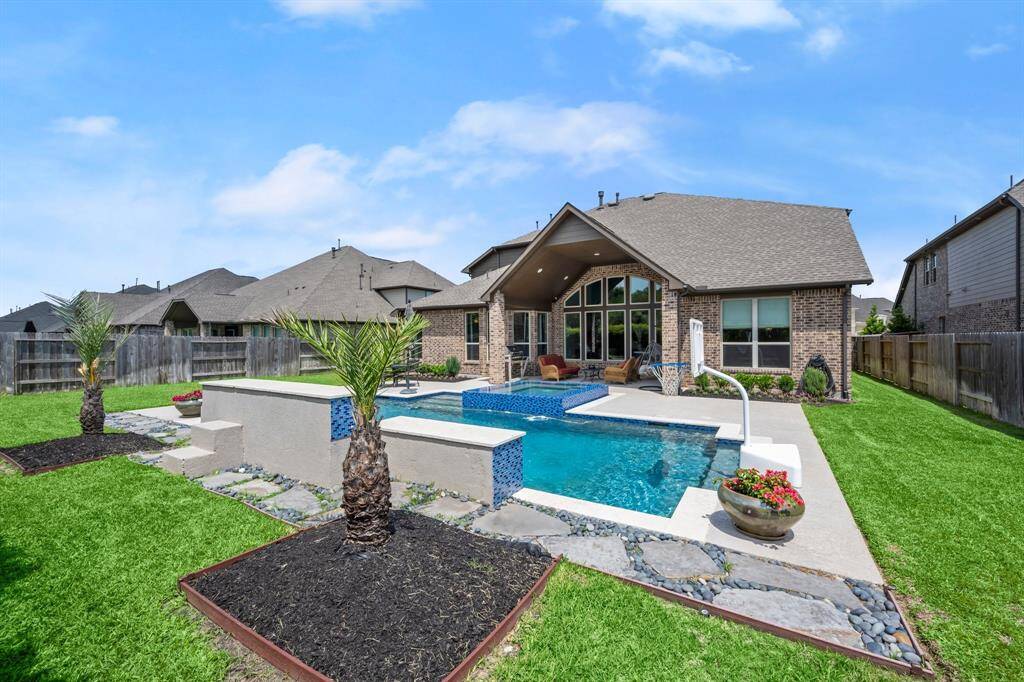 Professionally landscaped with room to play, relax, and host unforgettable gatherings.