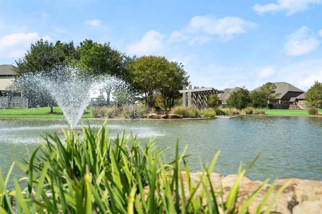 Another sitting area to enjoy overlooking the serene pond.