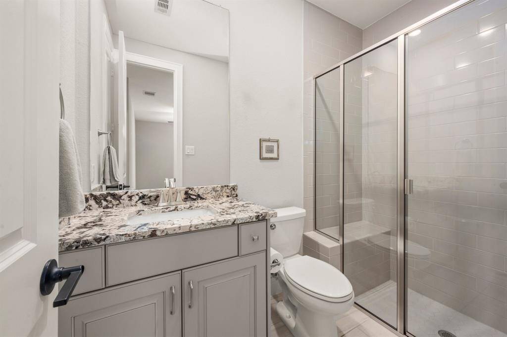 Full bathroom just off of the garage entrance, perfect for your guests.