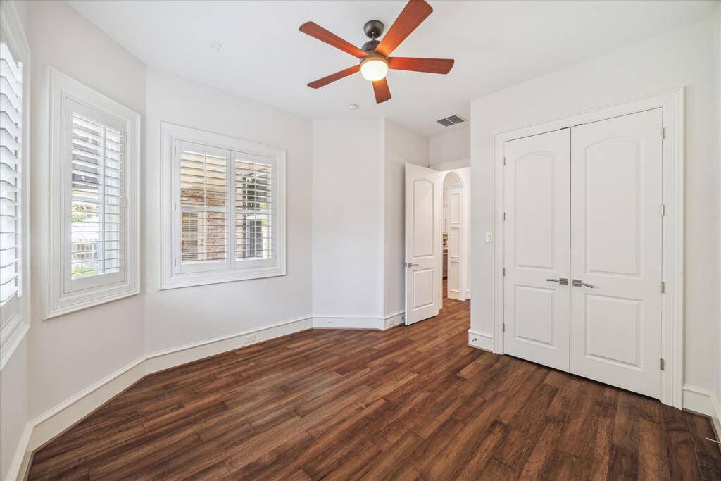 Located on the opposite side of the house near the kitchen, the second bedroom downstairs offers privacy and convenience.