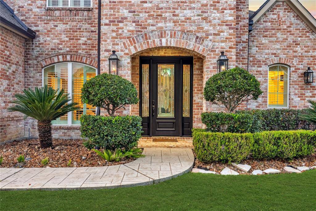 A grand and inviting entrance welcomes you with elegant gas lanterns.