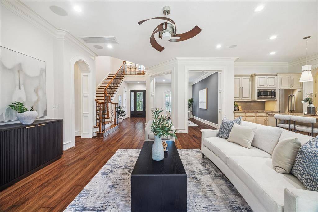 The open floor plan effortlessly connects the family room, kitchen, and dining areas, creating an ideal layout for entertaining.