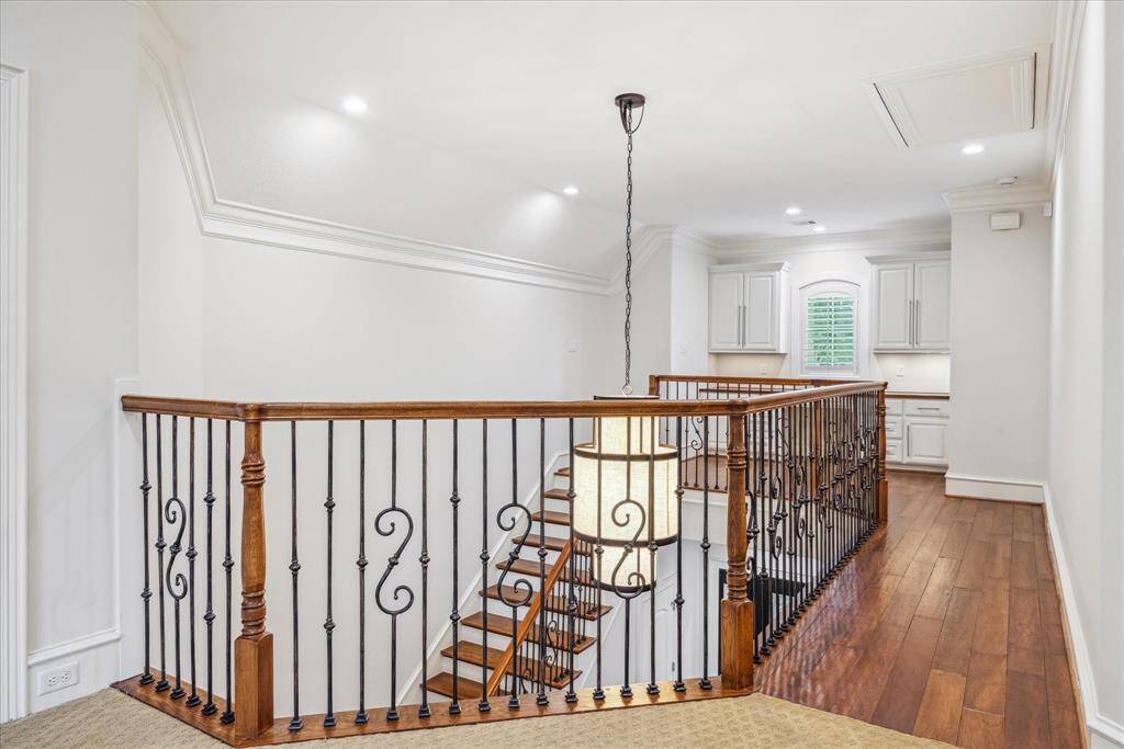 The upstairs landing provides a bright and airy space that creates a natural flow between the bedrooms and game room.