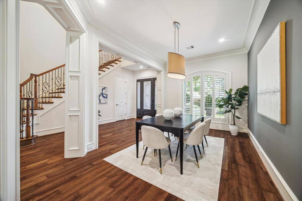 Just off the grand entry, the formal dining room offers an elegant first impression to the open floor plan downstairs.
