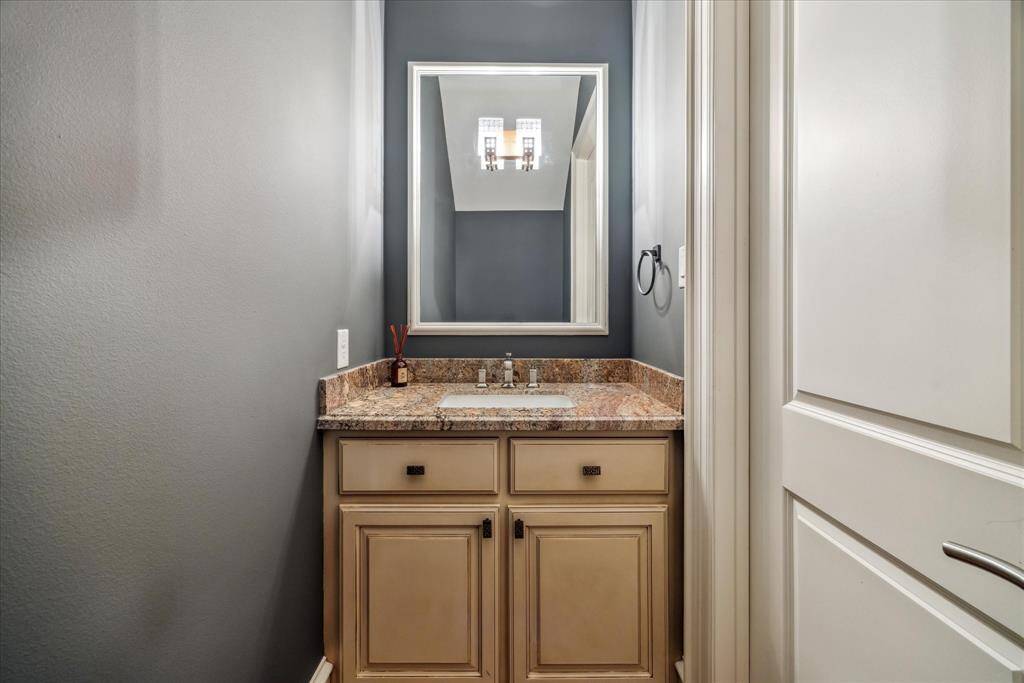 The powder room is conveniently tucked away off the entry.
