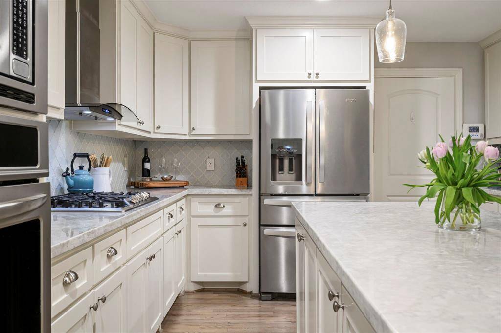 UPDATED KITCHEN - Enjoy cooking in this spacious kitchen! Tons of counterspace, upgraded shaker cabinets, stainless steel appliances and a gas range!