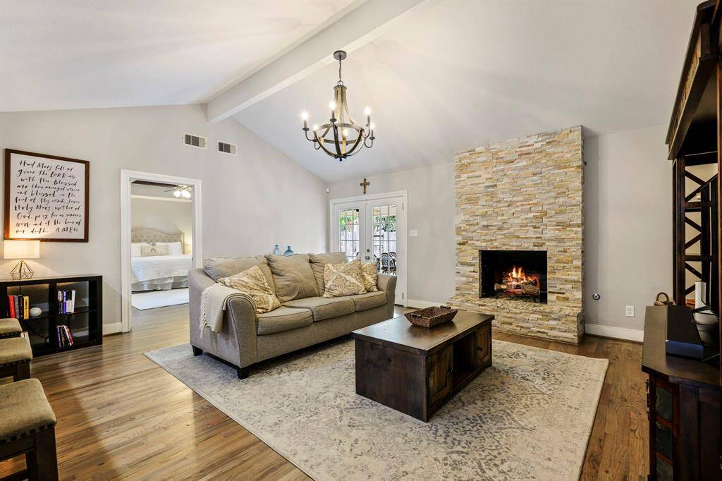 INVITING LIVING ROOM - This spacious living room with vaulted ceilings, hardwood flooring and a beautiful fireplace make this the perfect living space!
