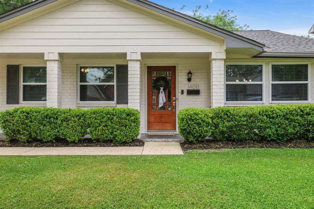 CHARMING FRONT EXTERIOR WITH RECENT ROOF & WELL-MANICURED LANDSCAPING
