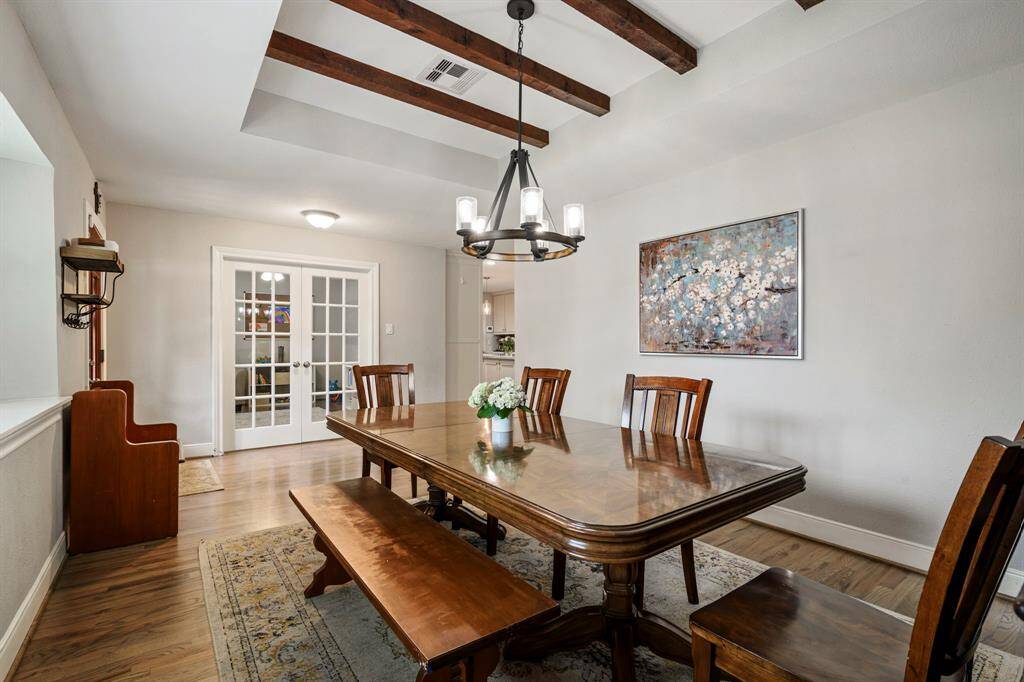 DINING ROOM - Updated chandelier & stunning wood-beam accents!