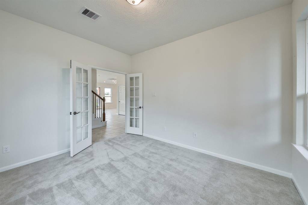 This is the room downstairs by the entry, can be used as a bedroom, study, office, workout room, craft room, endless possibilties