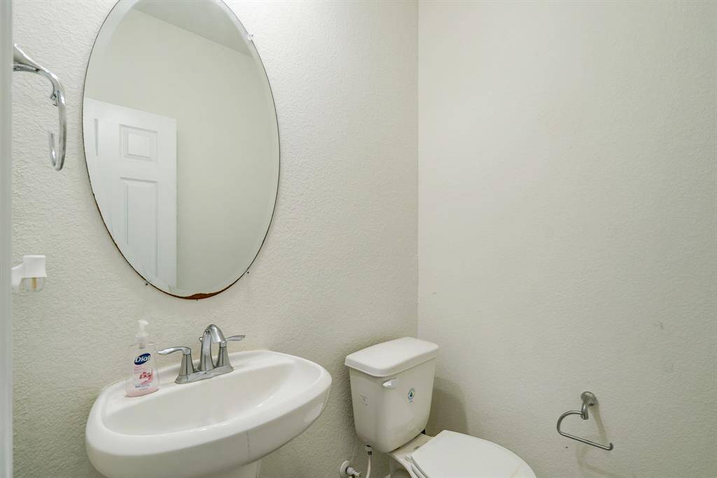 Powder room on the 1st floor by the staircase