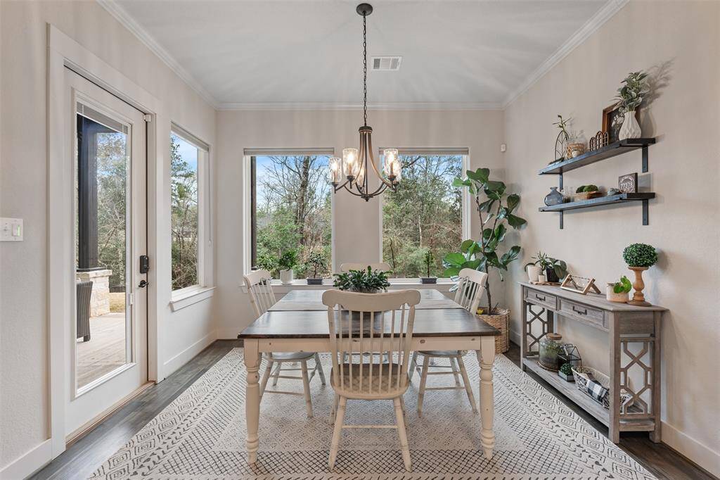 The dining room is just off the kitchen, great for entertaining, with beautiful views of your property.
