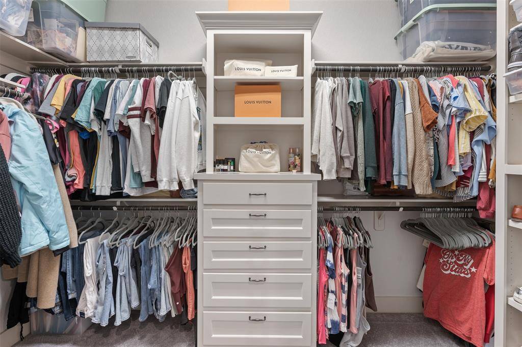 Just a peak inside on of the primary closets, complete with built-ins.