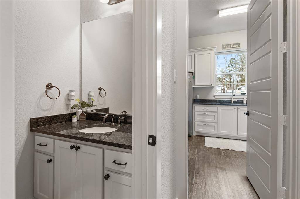Let's venture down the hall to the half bath, so conveniet for guests.
