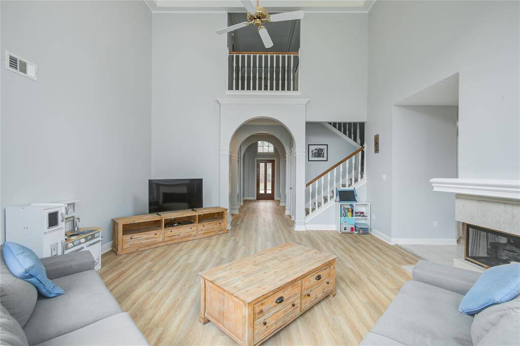 This is a large open space with a comfortable feel you are going to love.  The tall ceilings and crown molding add a dramatic flare to the space.