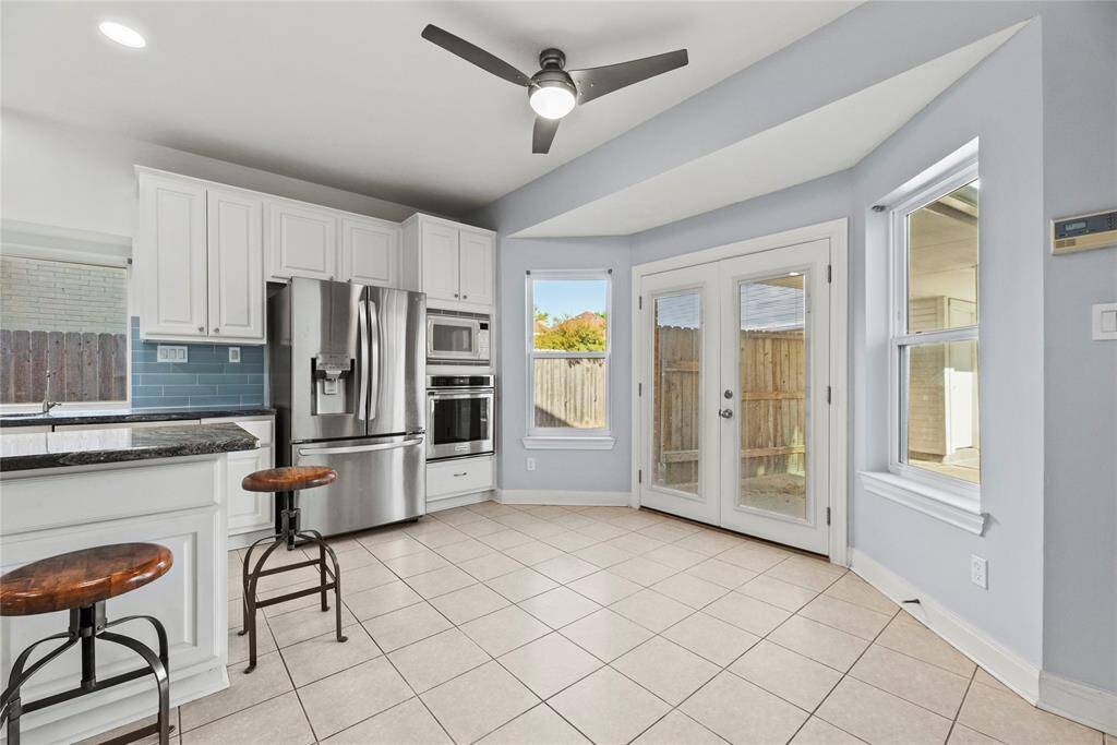 The breakfast space is ideal for those everyday meals and the large bright double doors  lead to your backyard for great entraining.