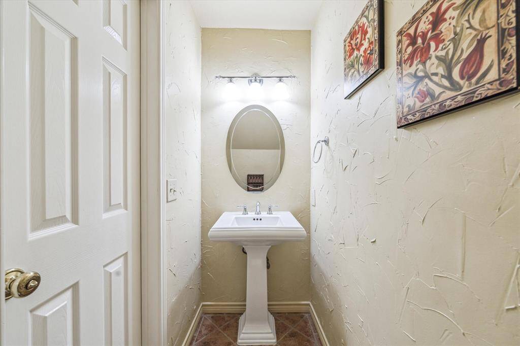 Half bath located downstairs by the entryway.