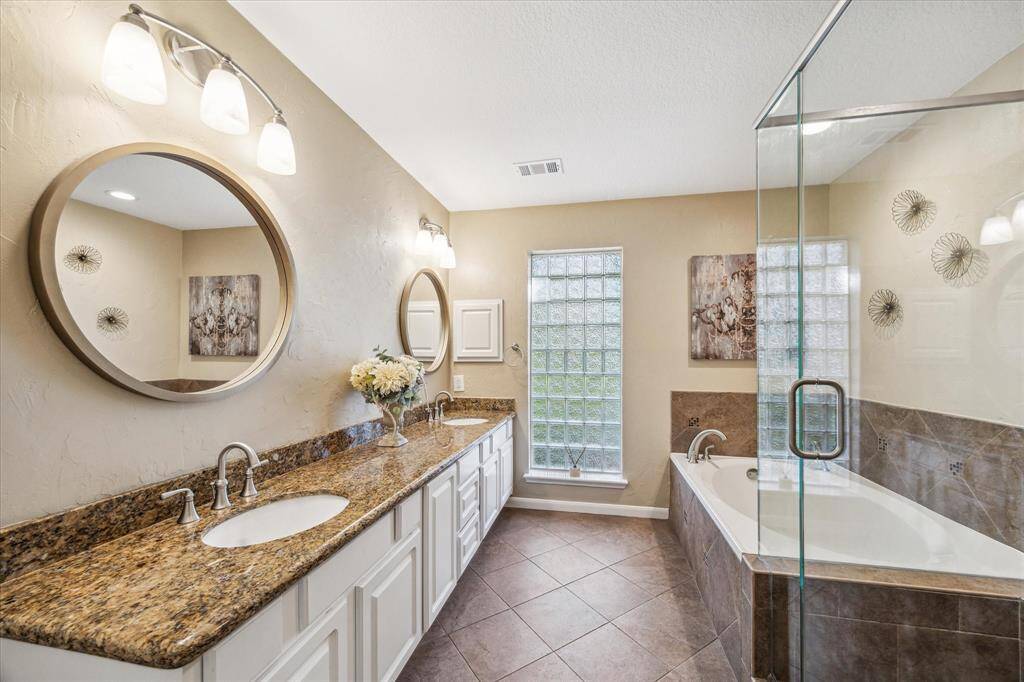Primary bath with separate shower, and soaking tub.