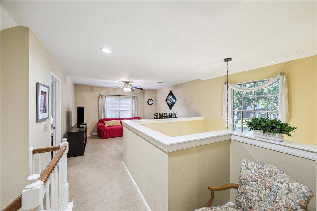 At the top of the stairs is a landing taking you to a game room, three bedrooms and a full bath.