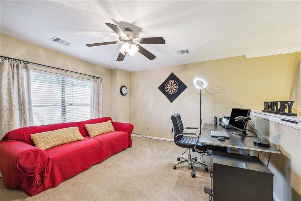 The game room with ceiling fan.