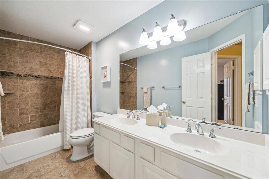 Upstairs bathroom is also updated and has double vanities and tiled shower/tub.