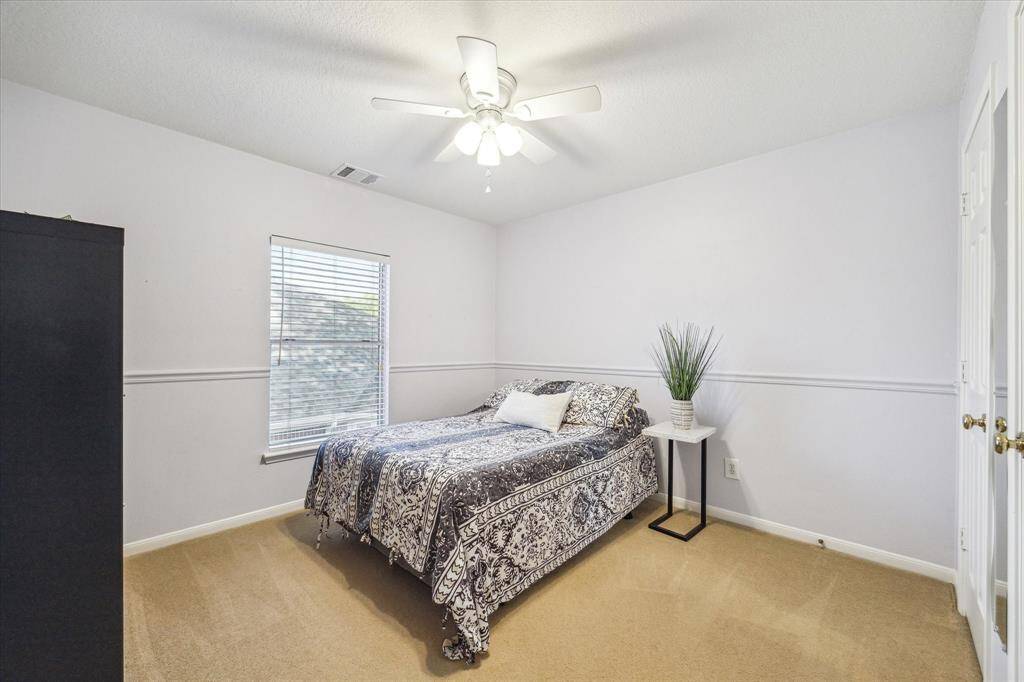 3rd of 4 bedrooms is upstairs with ceiling fan and double door closet.