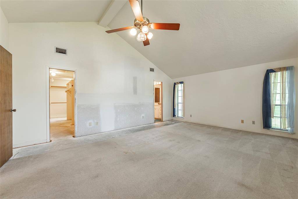 The second and larger primary in the main house with ensuite bath and large walk in closet
