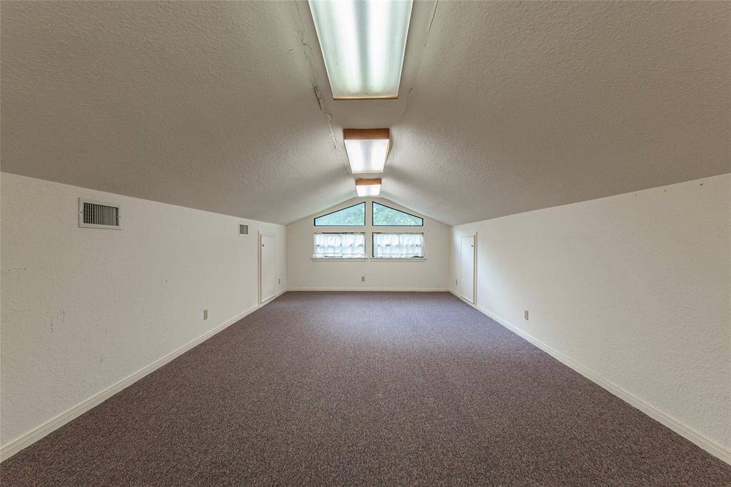 Loft area for additional sleeping space or game room above the garage at main house