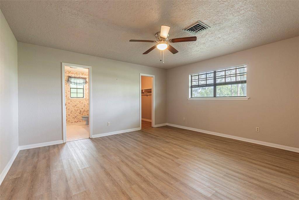 This is the original primary in the main house with its own walk in closet and ensuite bath