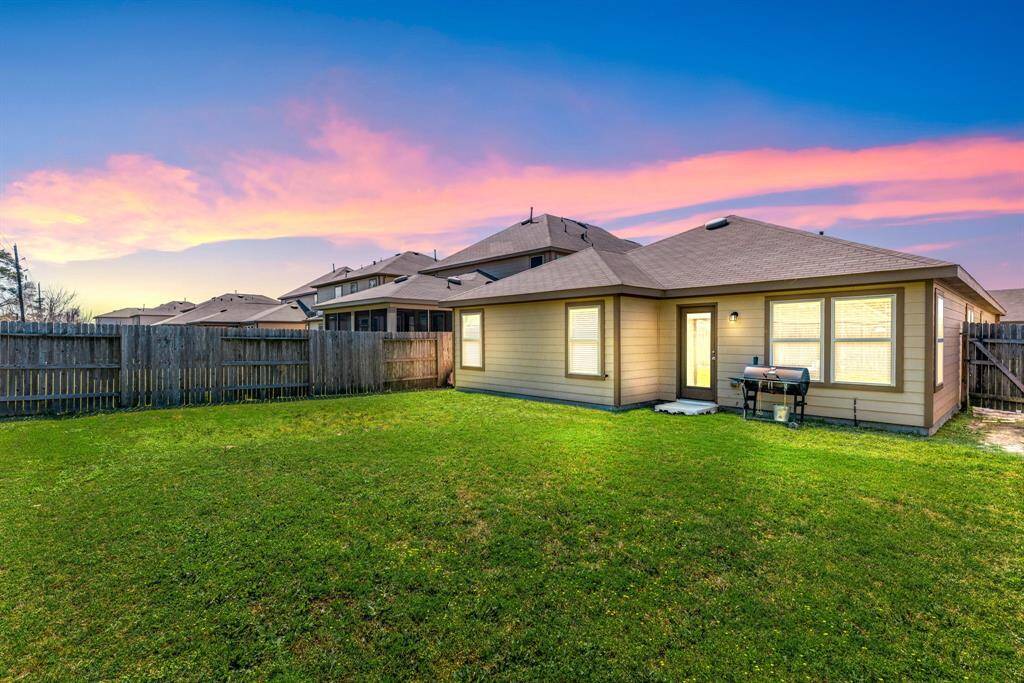 Come and see this spacious backyard with plenty of room for the kids to play and adults to relax!