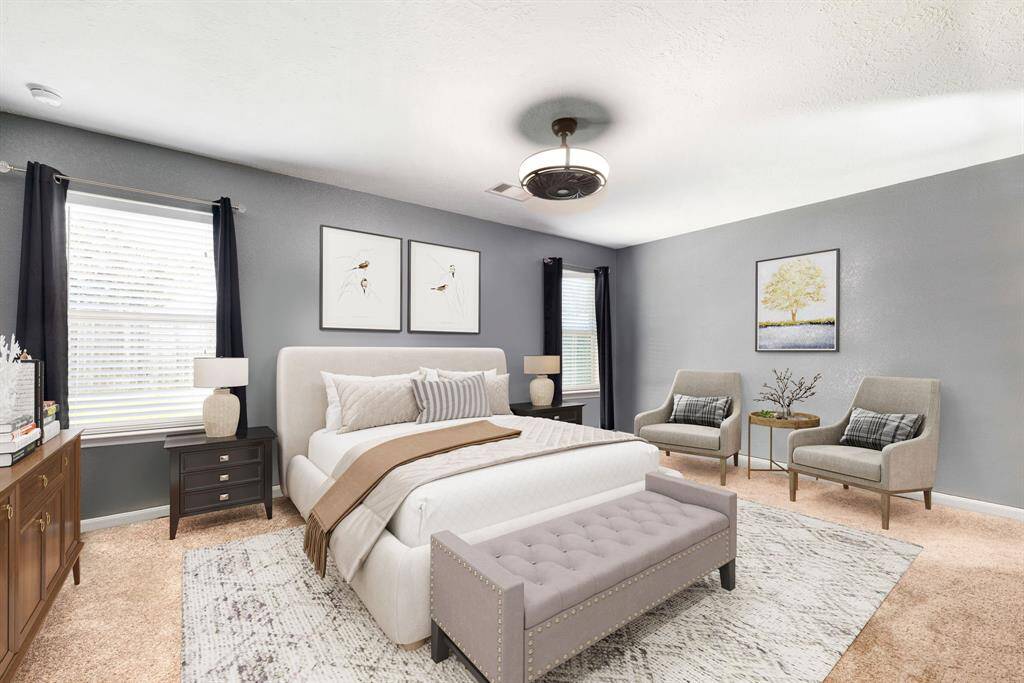 What a wonderful place to come home to, this stunning primary suite greets you with gorgeous carpet floors, custom paint, high ceiling, modern ceiling fan with lighting, lovely windows with blinds allowing in natural light brightening up this spacious primary bedroom, with extra space for a seating area.