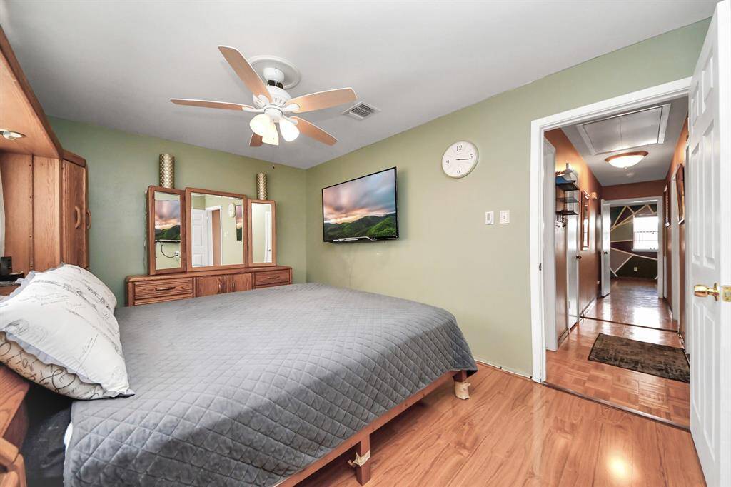 Room offers ample natural light through a window on the left, ideal for a comfortable bedroom setup.