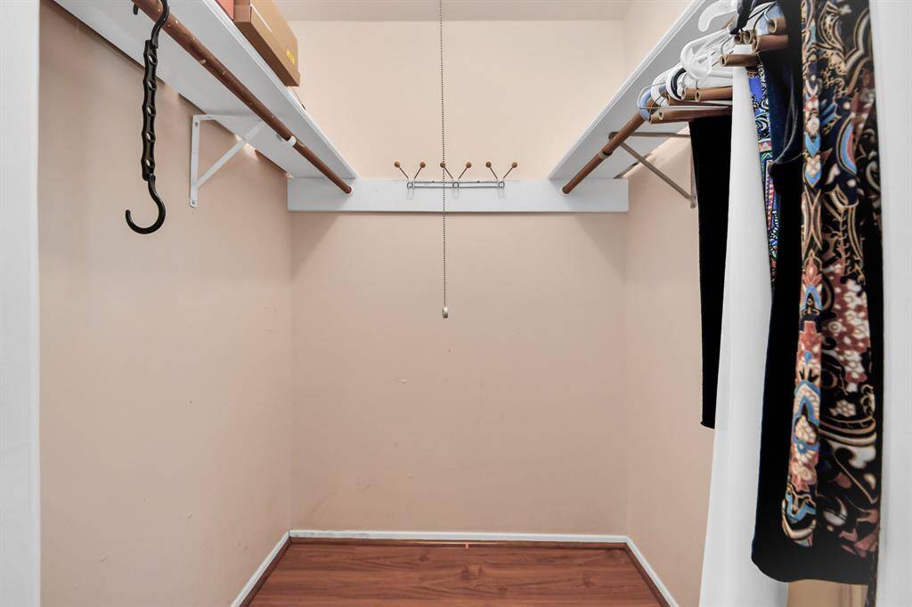 Spacious walk-in closet with shelves, providing ample storage space.