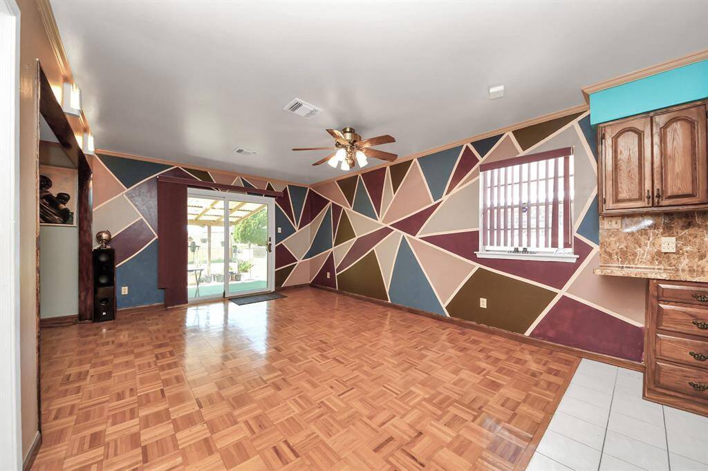 The space features a wood flooring and tile flooring, offering a versatile layout.