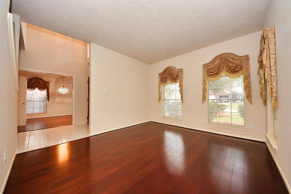 A Flex Room at the left of the entrance.  Can be used as office/library or formal living.