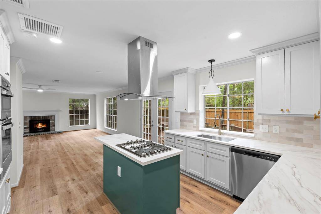 The home boasts stunning waterproof wood laminate floors throughout, providing both elegance and durability.