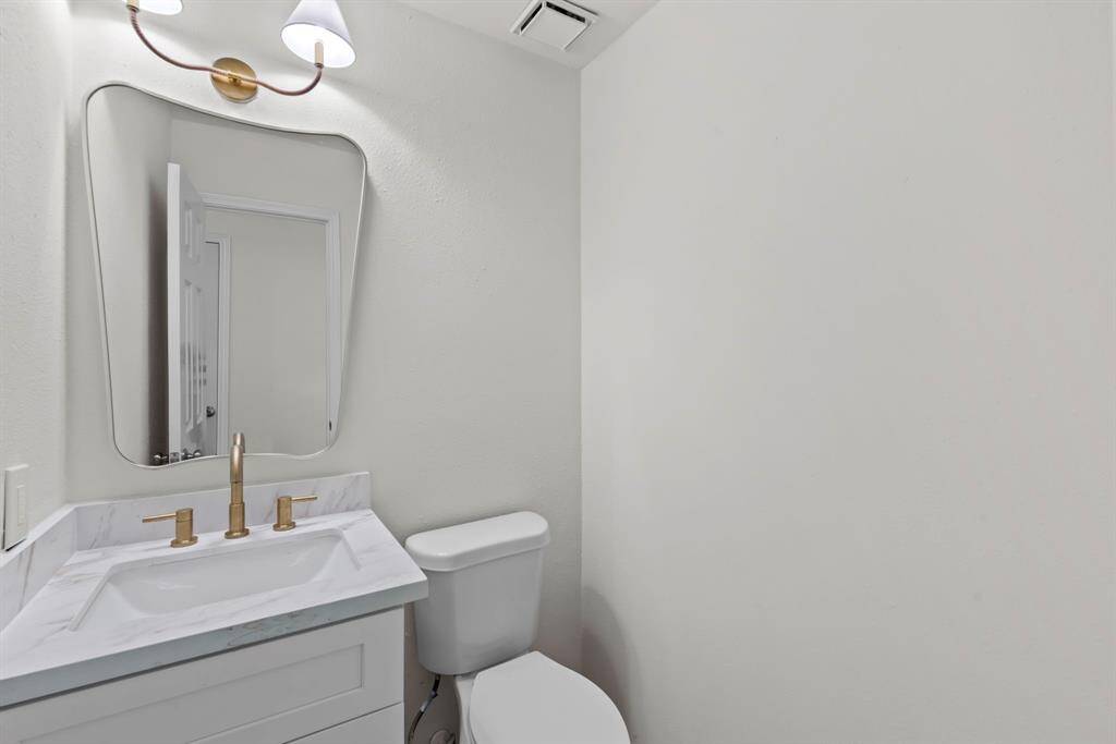 This stylish powder bath is conveniently located in the center of first floor.