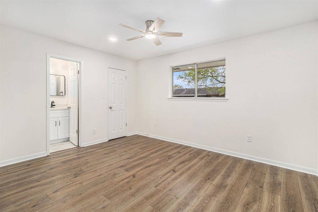 Laundry room with ample storage space.