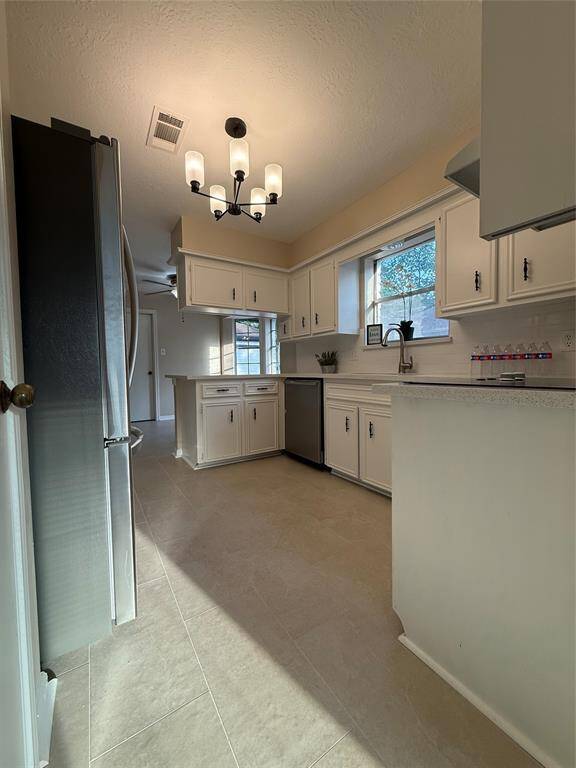A view of the kitchen from the formal dining room.
