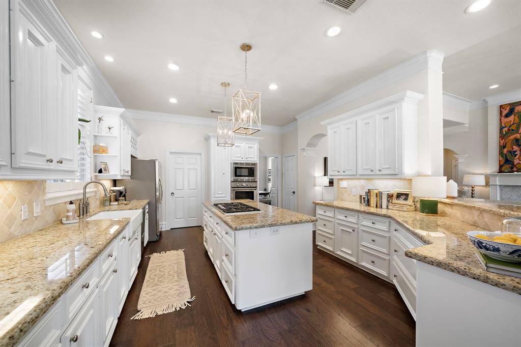 All appliances have been replaced: 5 burner gas cooktop, double drawer dishwasher, microwave, stove and bun warmer!!