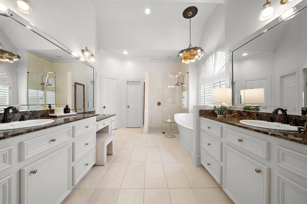 Lovely remodeled Master bath has a gorgeous free standing tub with hand held sprayer, & gorgeous lighting too! The shower, shower surround glass and shower head have all been replaced!