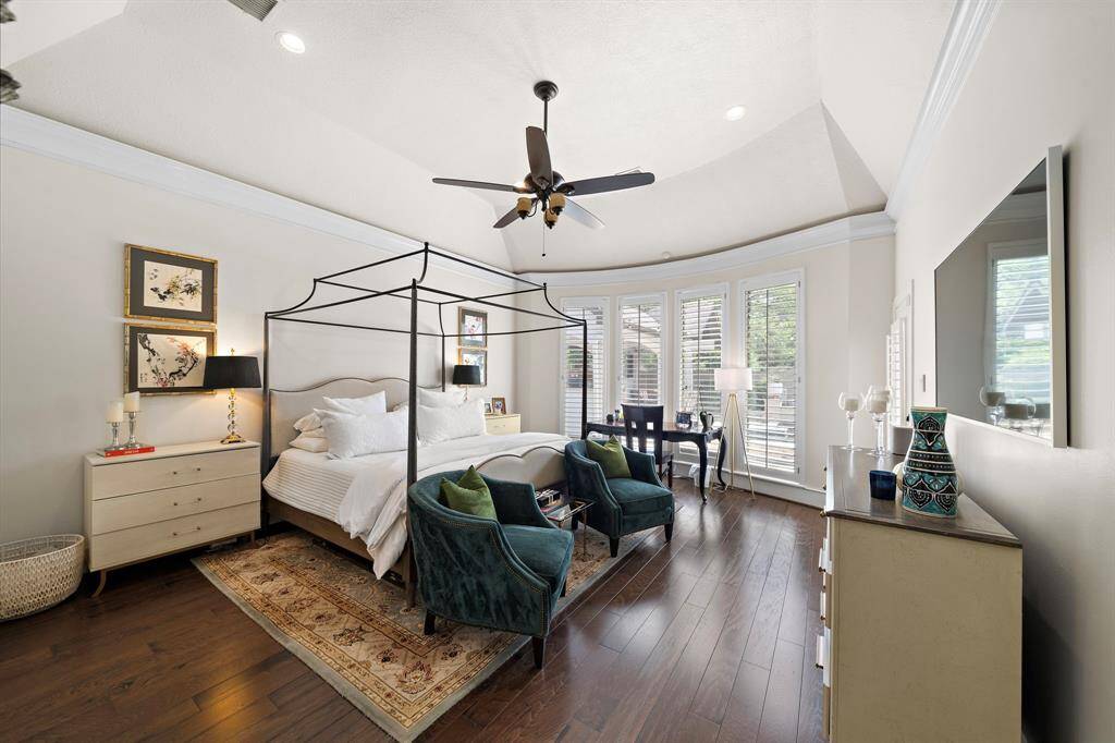 Spacious master bedroom with beautiful floors and a great view of the outdoor Oasis!