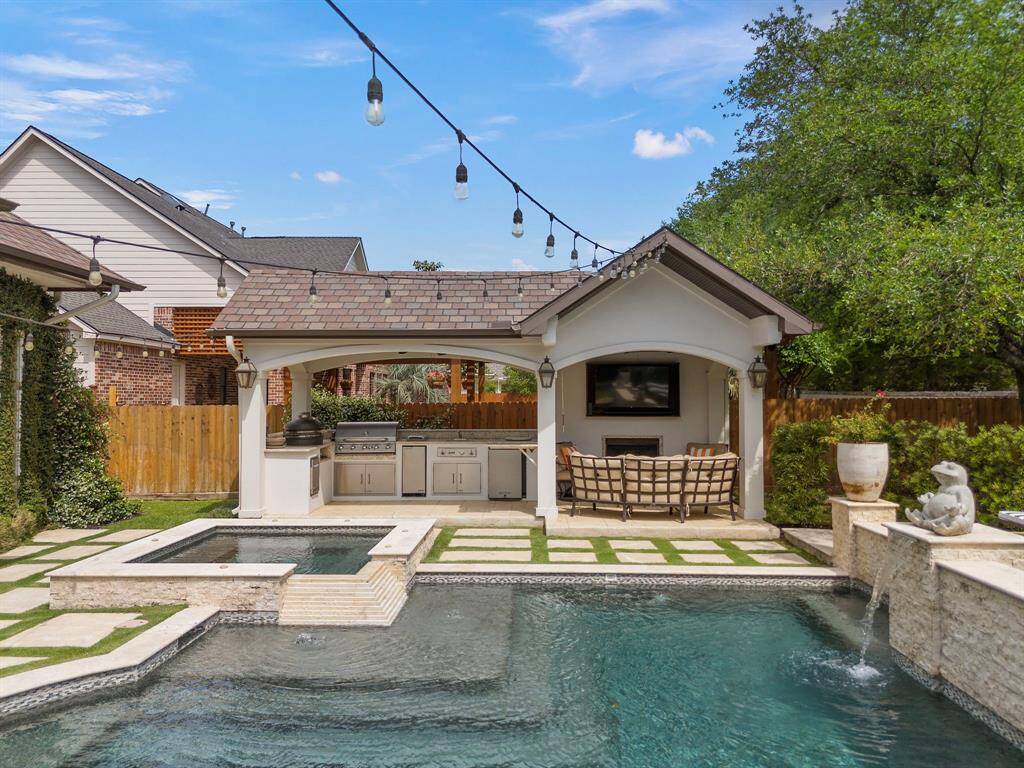 view of the outdoor kitchen with fireplace!