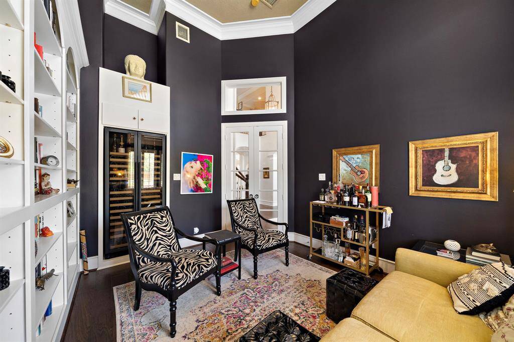 These sellers have made this a library/ Wine room with A built in Wine Fridge!