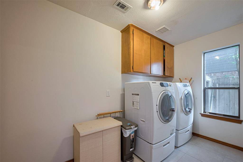Laundry Room offers an expansive layout and plenty of storage space.