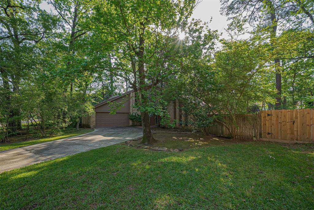 This stunning home features an oversized driveway and an expansive front yard, offering impressive curb appeal and ample space for both parking and outdoor enjoyment.